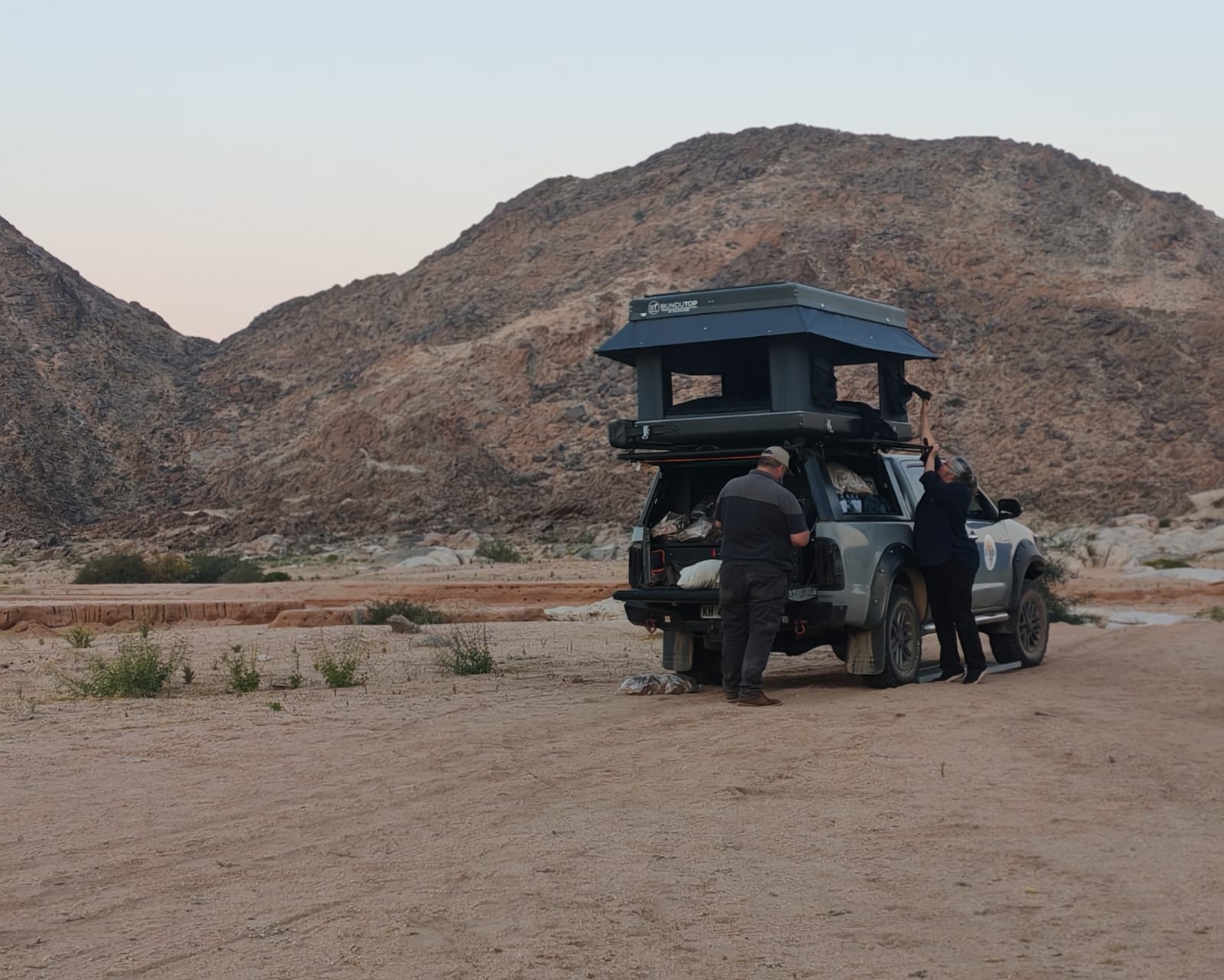 A prepared 4x4 with a rooftop tent on a remote route